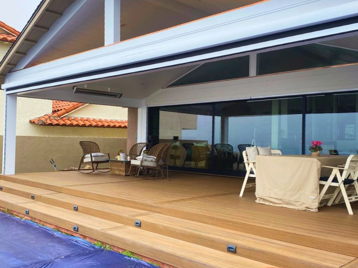 Outdoor motorized shade system installed on luxury patio — La Costa Shade